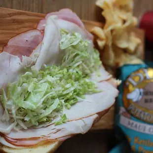 a ham and lettuce sandwich with chips