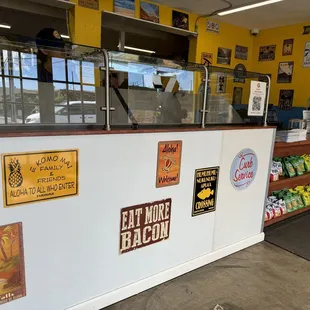 a counter with various stickers on it