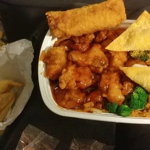 General Tso's chicken combo with fried rice and egg roll. Crab Rangoon appetizer.