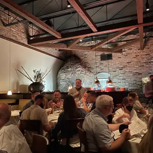 Main dining area with wood burning oven in the background