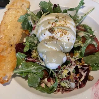 ROASTED RED AND YELLOW BEET SALAD WITH MIMMOS'S HANDMADE BURRATA, PISTACHIO VINAIGRETTE & BABY ARUGULA