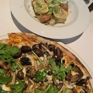 CHANTERELLE MUSHROOM PIZZA WITH ROSEMARY, CRESCENZA CHEESE AND BABY ARUGULA