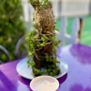 a cup of coffee on a purple table