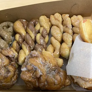 Red raspberry filled donut, peanut roll, apple fritters, blueberry donuts, tiger tails, and yeast donuts!