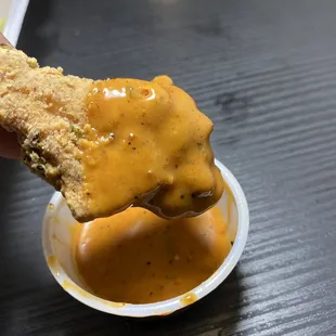Crispy wings dipped in honey hot sauce