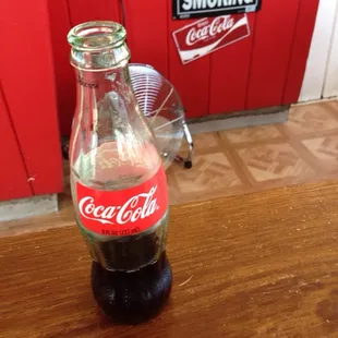 Sipping a cold Coke while I wait for my food (to-go)