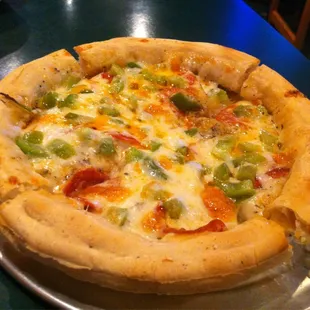 8" pizza topped with pepperoni and green peppers, using olive oil for sauce instead of marinara/pizza sauce.