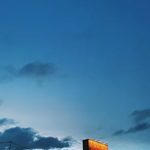 Tim&apos;s tavern sign with big blue sky