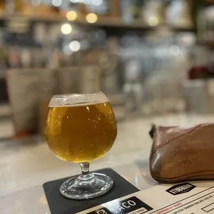 a glass of beer on a table