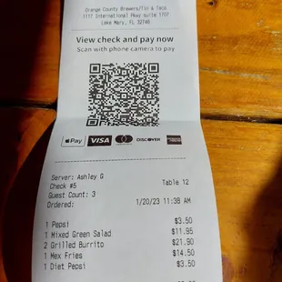 Total cost of two soft drinks, two burritos, loaded fries, and a salad is $59.20. Expensive lunch!