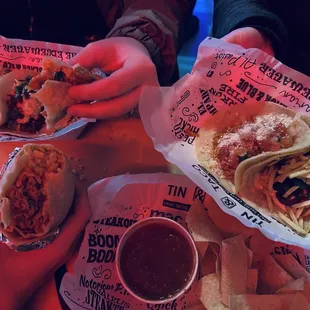 Various tacos and burritos at Tin &amp; Taco