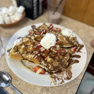 Waffle Breakfast with strawberry, chocolate and cream