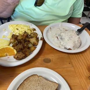 Country Fried Steak with 3 eggs and home fried potatoes