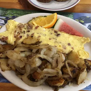 Bacon and cheese omelet, potatoes and onions, and sausage patties