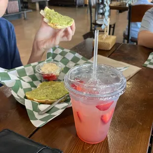 Strawberry lemonade and avocado toast on a bagel as they were out of sourdough