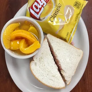 a sandwich and chips on a plate