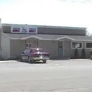 two trucks parked in front of a building