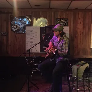 a man playing a guitar