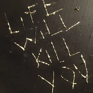 The writings on the turlet wall.