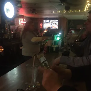 a man and a woman at a bar