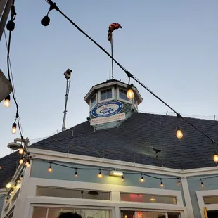  a restaurant with a clock tower