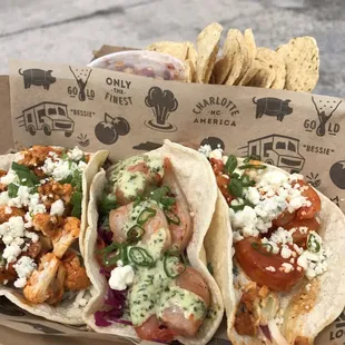 Cauliflower taco, cilantro lime shrimp taco, Buffalo shrimp taco, and chips and seasonal salsa.