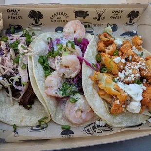 Beef brisket, cilantro lime shrimp, and buffalo cauliflower tacos