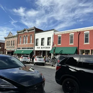 cars parked in front of a restaurant