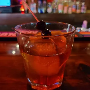 a drink in a glass on a bar