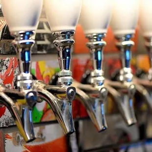 Reused and recycled tap wall of skateboard decks and European glazed ceramic tap handles.