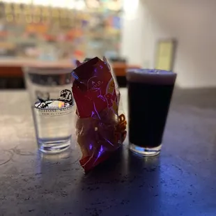 a glass of beer and a candy bar