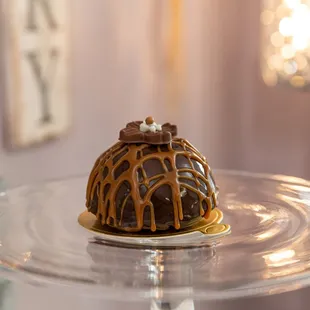 a chocolate cake on a glass plate
