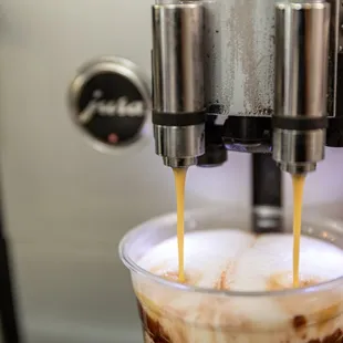 coffee being poured into a cup