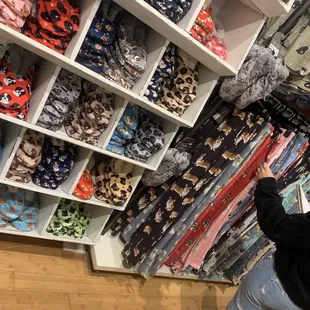 a woman shopping in a clothing store