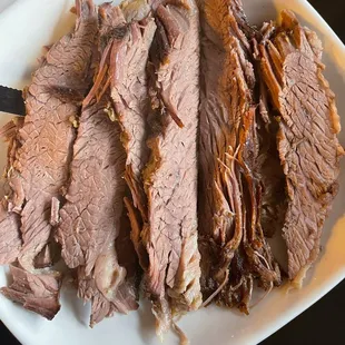 1 lb brisket $28. Not smoked, like some others photos show.