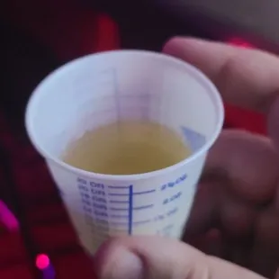 This may look like a urine sample, but it's actually an $8 green tea shot