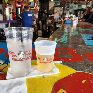 a plastic cup and a plastic cup on a table