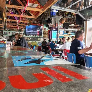 a man sitting at a table in a diner