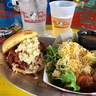 Pulled pork sandwich with house salad.