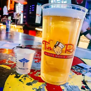 a pint of beer on a table