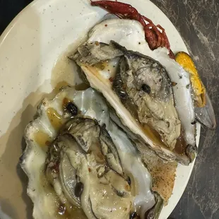 three oysters on a plate