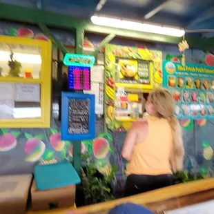 a woman standing at a counter