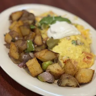 Eggs and Potatoes Plate with Scrambled eggs with Onions and Bell Peppers added