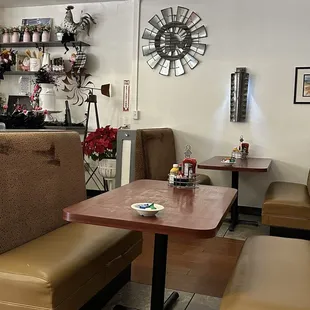 Booth seating. Larger table seating in the back.