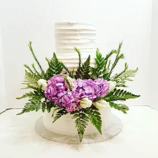 A touch of lavender and greenery for this 3 tier wedding cake