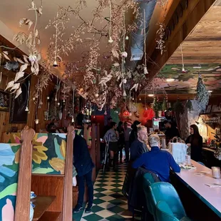 people sitting at tables in a restaurant