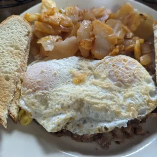 Corned beef hash plate with over easy eggs