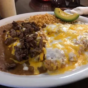 House Specialty, Tina's Special. Hand battered Chicken Fried Steak, Enchiladas rice and beans
