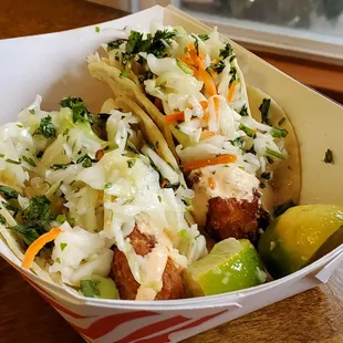 Fish tacos with crisply fried cod and a tasty fresh coleslaw blend.