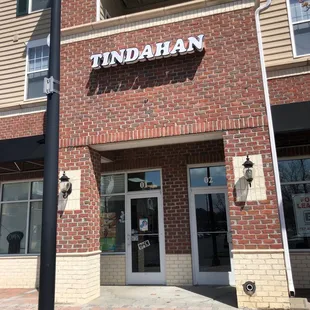 the front of a brick building